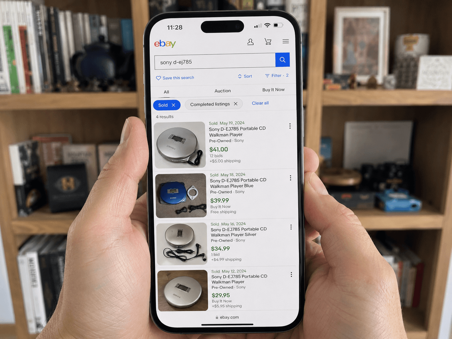 Reseller checking completed sales before pricing a used item