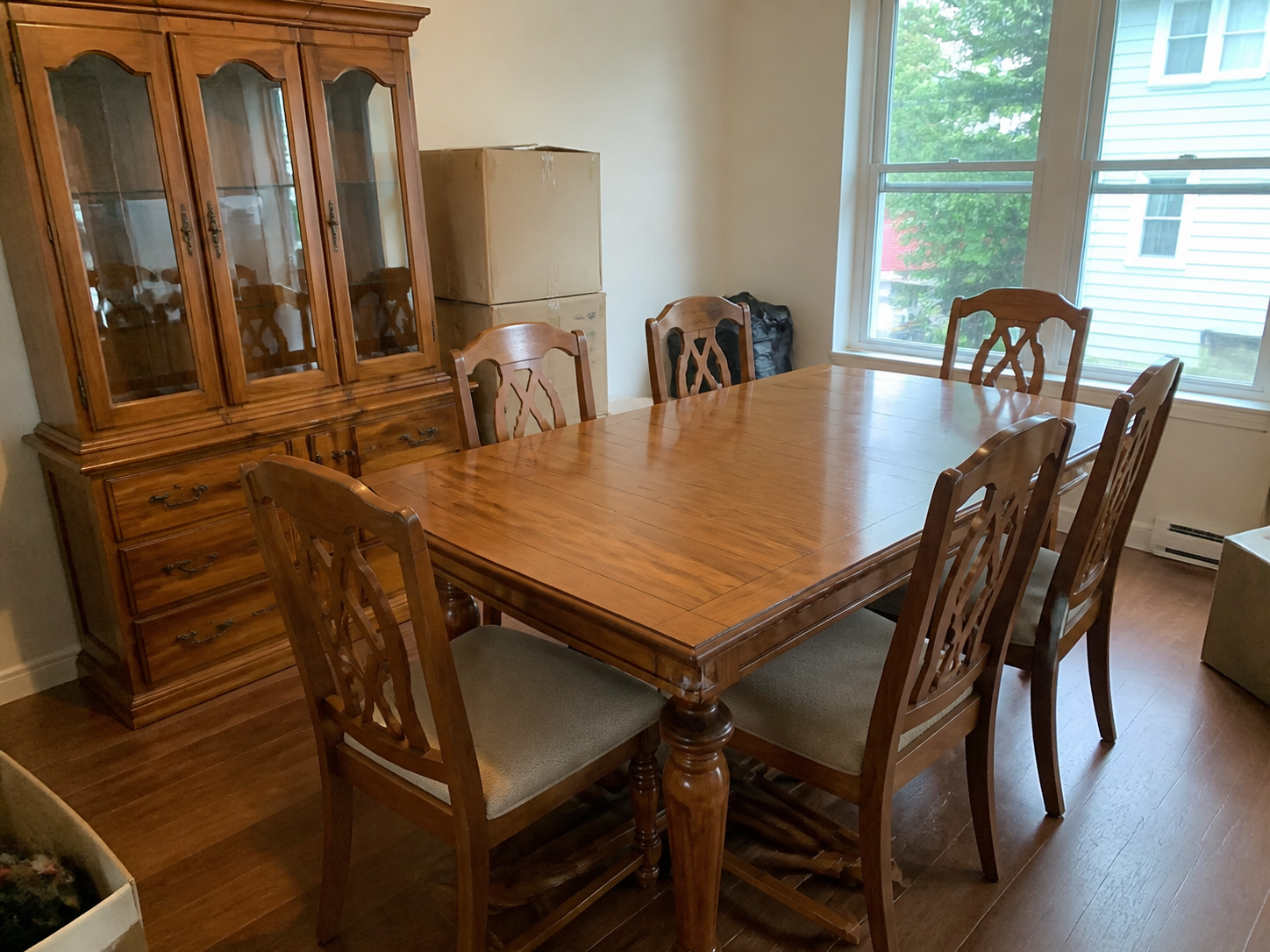 Fictional seller photo of a wood dining set with six chairs and china cabinet